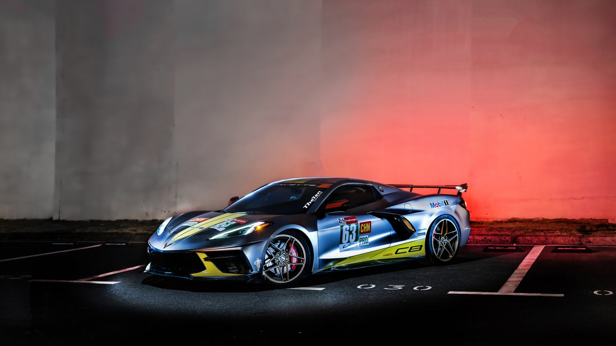 A custom carbon fiber steering wheel inside a performance vehicle